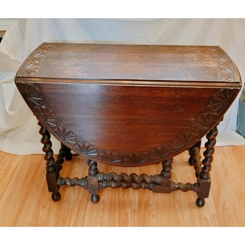 815 - Oak Carved Drop Leaf Oval Table with Barley Twist Legs. Closed measures 73cm High, 92cm x 42cm. Open... 