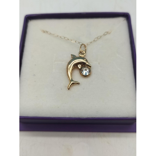 100 - 9ct Gold Dolphin Stone Set Pendant and Chain. 1.1 Grams.