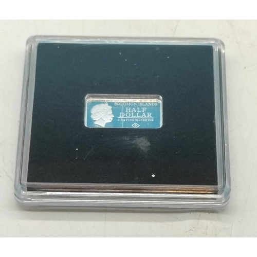 94 - Cased 999 Fine Silver Solomon Islands Half Dollar 2.5 Gram Ingot.