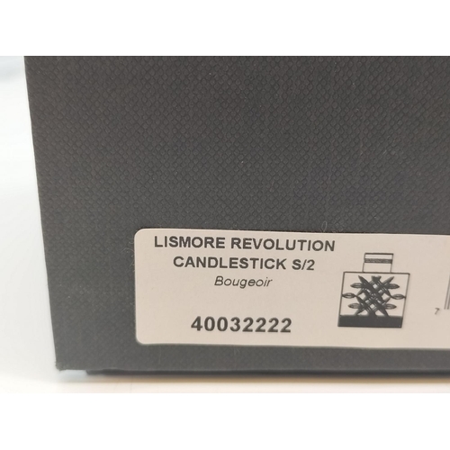 54 - Boxed Waterford Crystal 'Lismore Revolution' Candlesticks. Each Measures 10cm High, 8cm x 4cm.