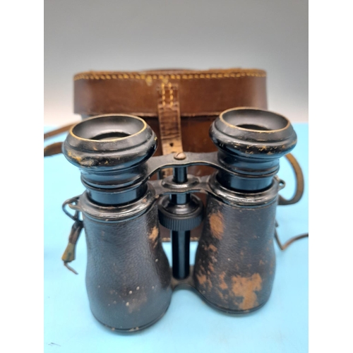 724 - Royal Marine Binoculars in Brown Leather Case.