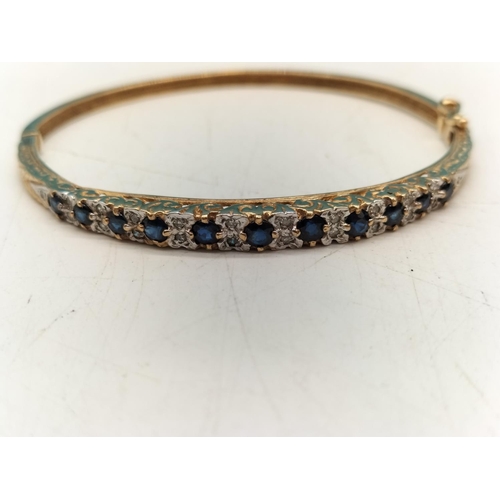 8 - 9ct Gold 375 Diamond and Sapphire Bracelet. Inner Rim 5cm Diameter. Total weight 11 Grams.