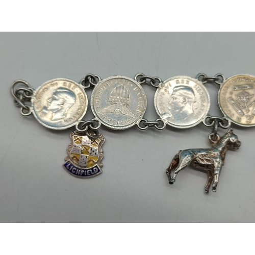 89 - Silver .500 Coin Bracelet with Silver Charms. Unmarked. Total Weight 36.7 Grams.