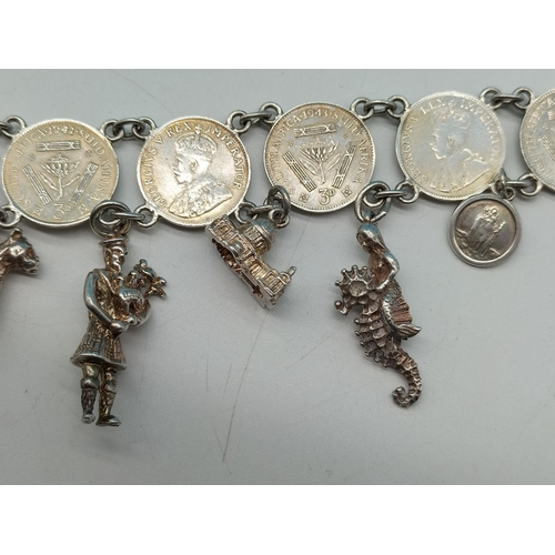 89 - Silver .500 Coin Bracelet with Silver Charms. Unmarked. Total Weight 36.7 Grams.