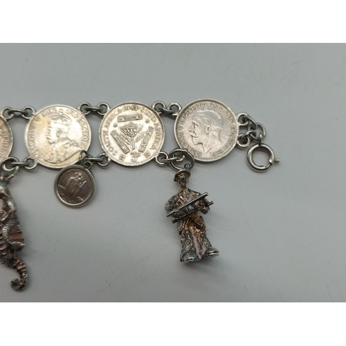 89 - Silver .500 Coin Bracelet with Silver Charms. Unmarked. Total Weight 36.7 Grams.