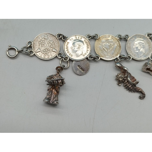 89 - Silver .500 Coin Bracelet with Silver Charms. Unmarked. Total Weight 36.7 Grams.