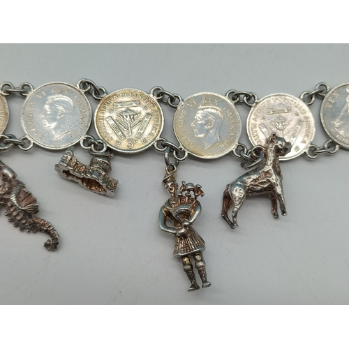 89 - Silver .500 Coin Bracelet with Silver Charms. Unmarked. Total Weight 36.7 Grams.