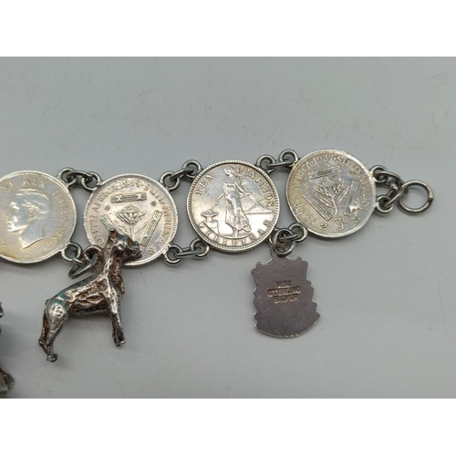 89 - Silver .500 Coin Bracelet with Silver Charms. Unmarked. Total Weight 36.7 Grams.