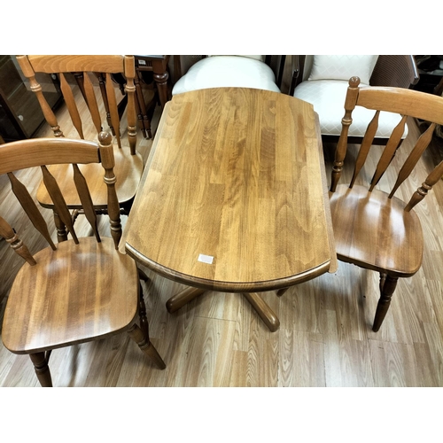 429 - Circular drop leaf kitchen table and three chairs. Collection ONLY