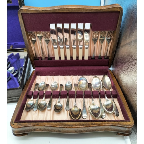 689 - two vintage canteens of cutlery, A Modern stainless streel cutlery set, a cake slice with silver hal... 