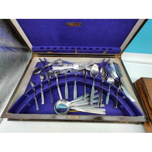 689 - two vintage canteens of cutlery, A Modern stainless streel cutlery set, a cake slice with silver hal... 