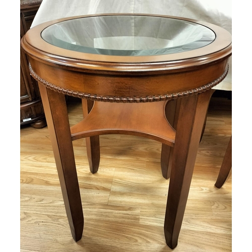 74 - two matching bevel edged glass topped circular side tables. H61 D46cm. Collection ONLY