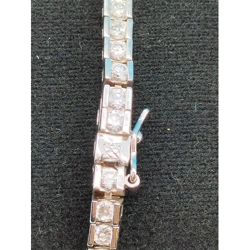 79 - 925 silver stone set tennis bracelet.