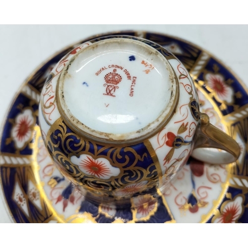 106 - Royal Crown Derby Imari pattern 5 coffee cups and saucer (Various date marks )