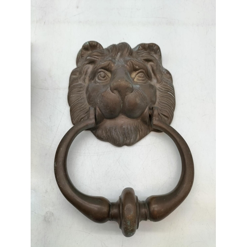 16 - Bronze Lion head Door Knocker 20x12cm and a Brass hand pull doorbell. 20x12cm