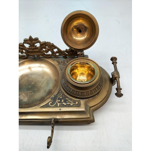 21 - Brass desk top stand with twin ink wells and letter opener 28x15x11