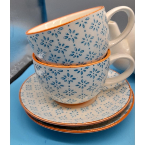 285 - Nicola Spring contrast Blue and Orange 11piece part tea set 
Teapot H13cm