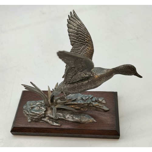 315 - Pewter model of a Mallard Duck in flight mounted on wooden plinth in the style of AR Brown 12x10cm