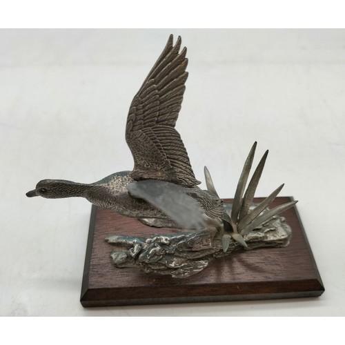 315 - Pewter model of a Mallard Duck in flight mounted on wooden plinth in the style of AR Brown 12x10cm