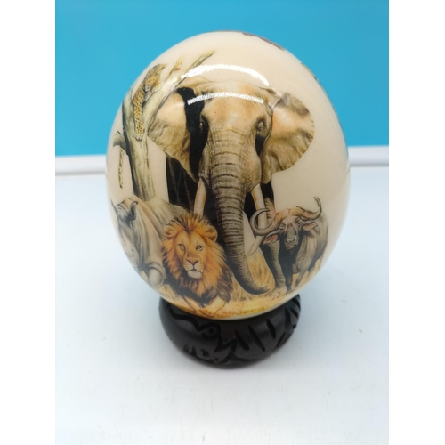 265 - Ostrich Egg with Wildlife Design on Stand. 17cm Tall.