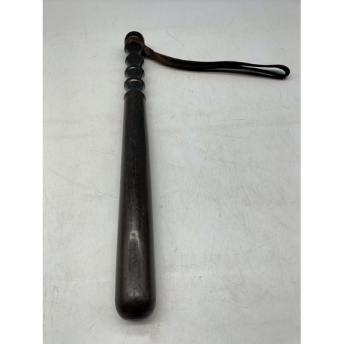 286 - Police Truncheon Lignum Vitae with Original Strap. 38cm Long.