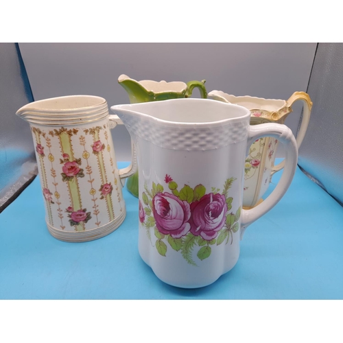 306 - Ceramic Jugs (4) to include S.Fielding 'Frome' Pattern (c1913-1930). Tallest being 22cm.
