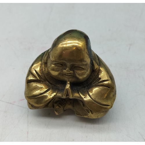 577 - Praying Brass Buddha Figure. 5cm x 5cm.