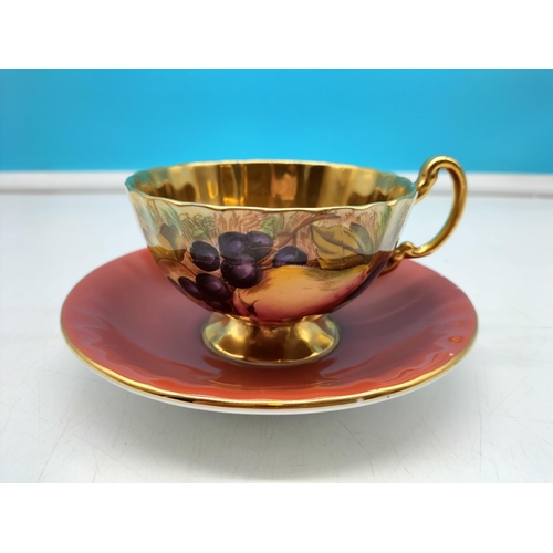 292 - Aynsley Maroon Red and Gold Gilt Saucer with Orchard Gold Cabinet Cup. Signed D Jones.