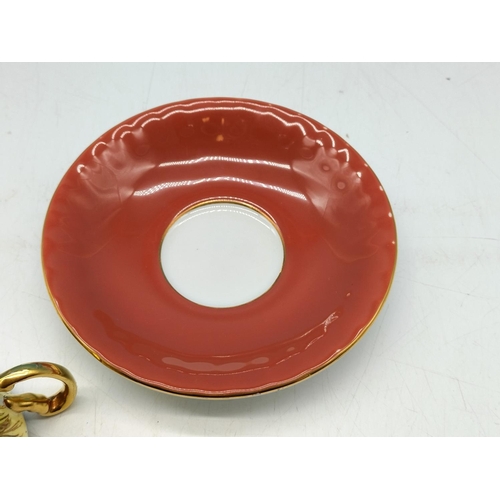 292 - Aynsley Maroon Red and Gold Gilt Saucer with Orchard Gold Cabinet Cup. Signed D Jones.
