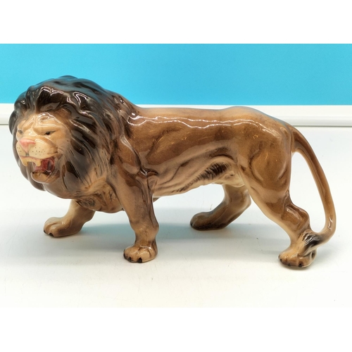 298 - Melba Ware Lion Figure. 15cm High x 27cm.