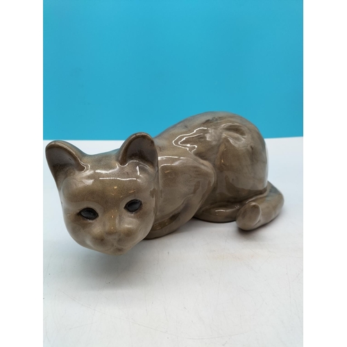 272 - Large Pottery Cat Figure. 13cm High, 31cm x 16cm.