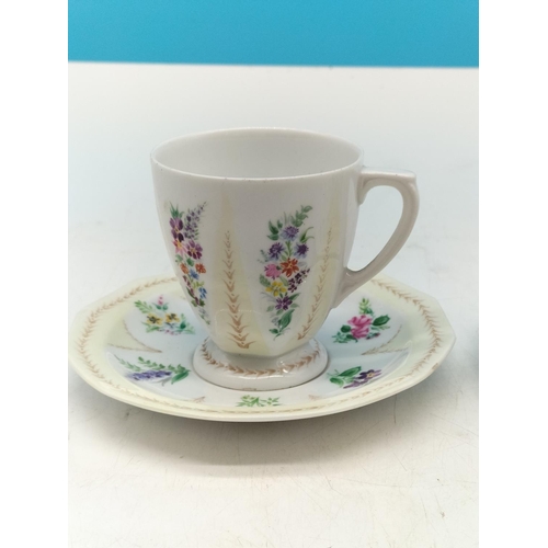 597 - Hand Painted Cups and Saucers (2). Signed by the Artist 'Margaret Nancy Cotterill 1953' to Base. On ... 