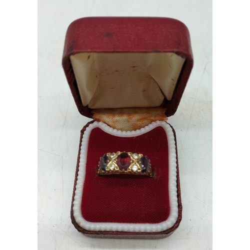 159 - Hallmarked 375 9ct Gold Garnet and Clear Stone set Ring. Size P. Overall Weight 3.2 Grams.