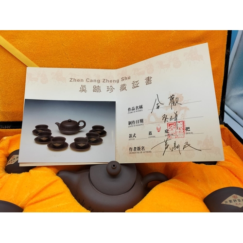 235 - Boxed Zhen Cang Zheng Shu Tea Set with Certificate of Authenticity.