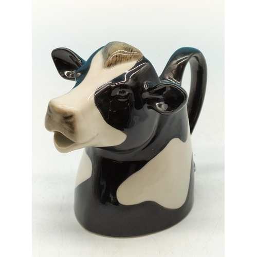 30A - Quail Pottery 'Friesian Cow' Half Pint Milk Jug. 13cm Tall.