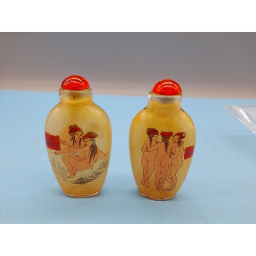 30 - Oriental Scent Bottles depicting Nude Figures (2). 7.5cm Tall.