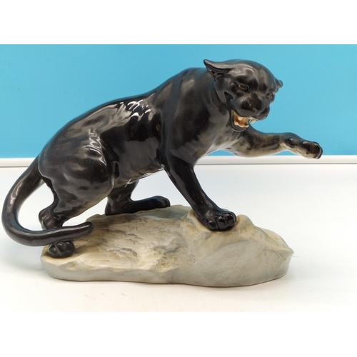 312 - Beswick Figure of a Black Puma on Rock. 21cm High x 32cm.