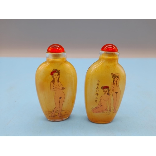 63 - Oriental Scent Bottles depicting Nude Figures (2). 7.5cm Tall.