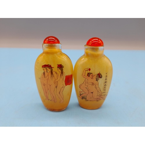 63 - Oriental Scent Bottles depicting Nude Figures (2). 7.5cm Tall.