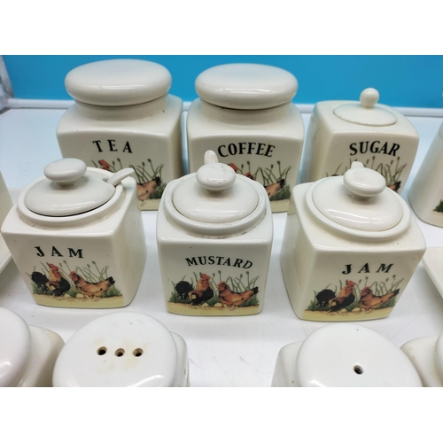 712 - Kitchenware with 'Cock and Hen' design to include Storage Jars, Cheese Dish, Butter Dish, etc.