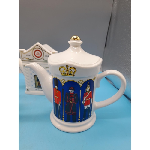 323 - 4 x Wade Teapots - 'Guards - London Life', 'Florrie's Flowers', 'Christmas' and 'Valor Fires'.