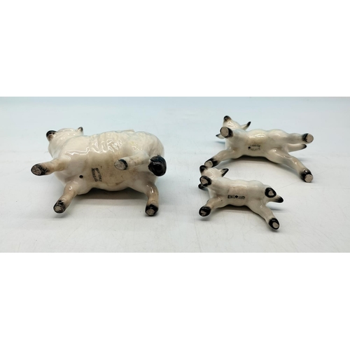 28 - Beswick Sheep and Lamb Figures. Largest 9cm x 9cm.