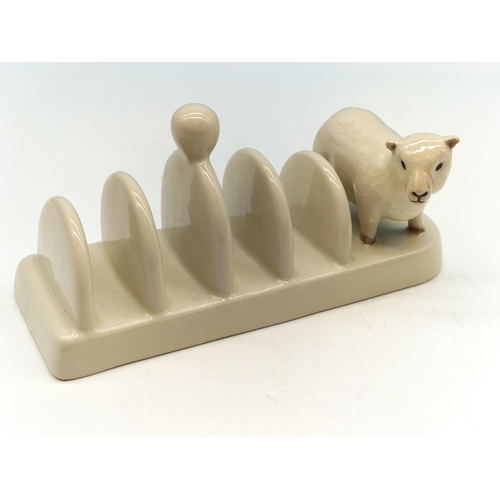 42 - Quail Pottery 'Lamb' Toast Rack. 9cm High, 19cm x 7cm.