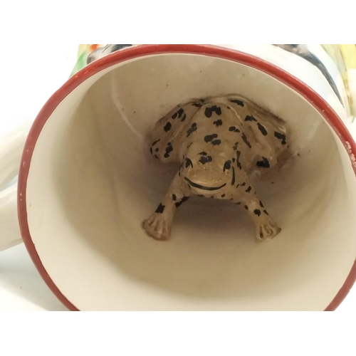 5 - Victorian Hand Painted Twin Handled Mug with Frog Inside and Hunting Scenes to Outside. 14cm High.