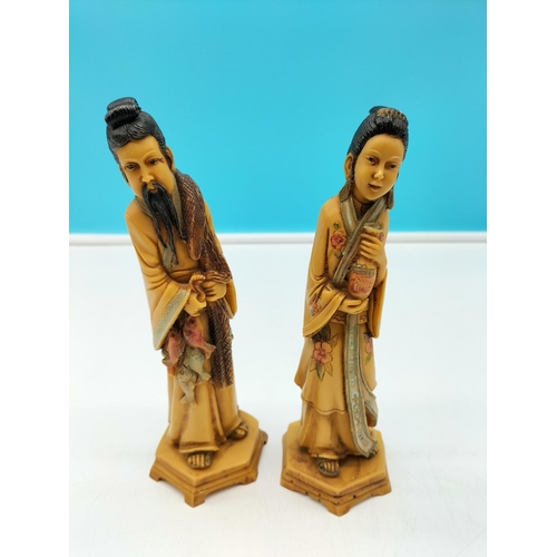 592 - Pair of 21cm Oriental Man and Lady Figurines.