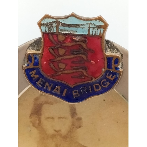 10A - Victorian Photo Frames (2) with Enamel 'Menai Bridge' Badges. 11cm x 6cm.