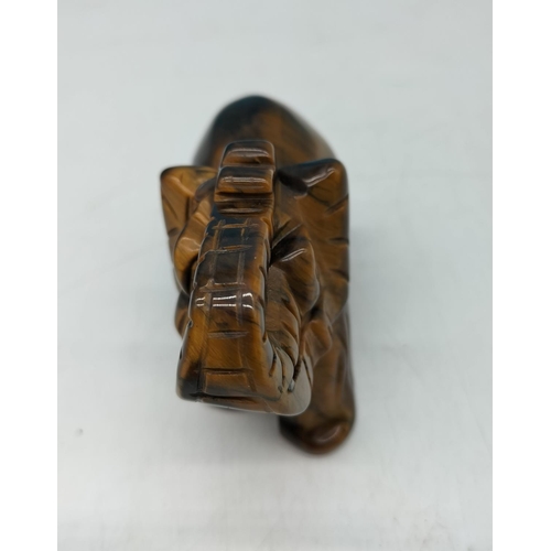 139 - Hand Carved Tigers Eye Elephant Figure. 8cm x 6cm.