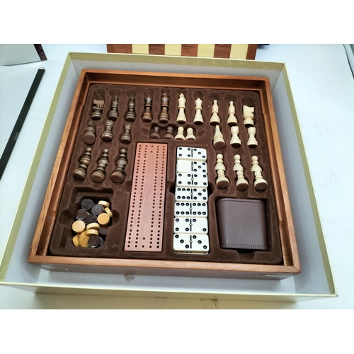 148 - Premier 7 Game Set to include Chess, Draughts, Backgammon, etc. Board measures 34cm x 34cm x 7cm.