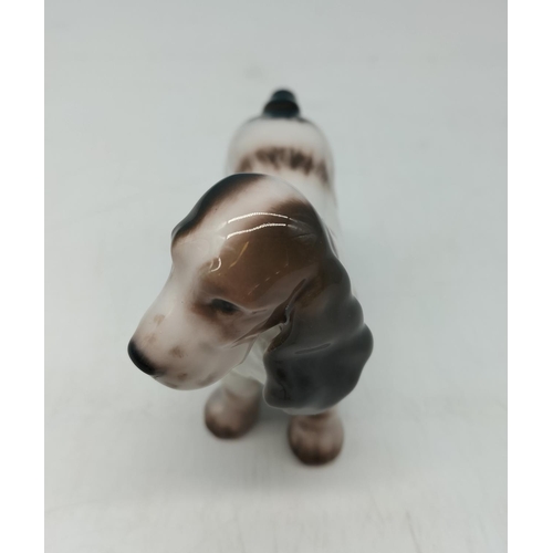 272 - Royal Copenhagen Figure of a Spaniel Dog. 8cm high, 11cm long.