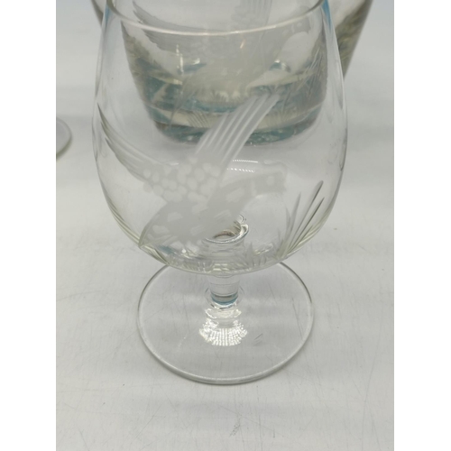 275 - Glass Decanter and Glasses (5) with an Etched Pheasant Design. Decanter 28cm high.